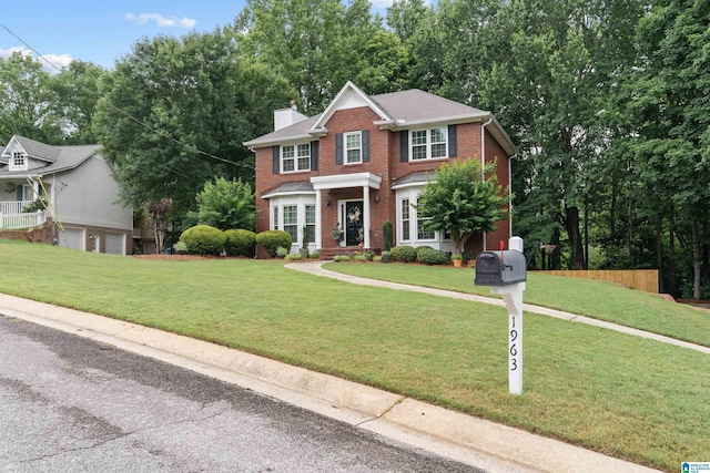 1963 Russet Hill Ln, Hoover, AL 35244 - view of front of property with brick siding, a chimney, and a garage