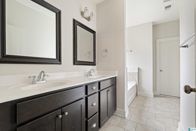 3024 Camellia Ridge Ct, Pelham, AL 35124 - full bathroom featuring double vanity, a bath, and tile patterned floors