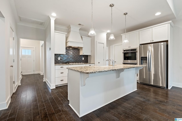 3024 Camellia Ridge Ct, Pelham, AL 35124 - kitchen featuring stainless steel appliances, premium range hood, backsplash, a kitchen breakfast bar, and ornamental molding