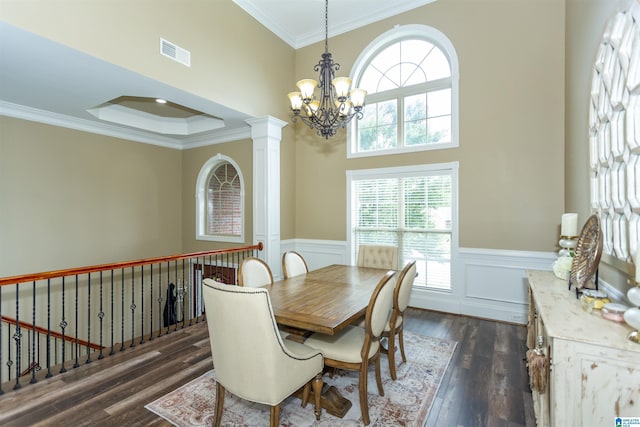 295 Homestead Dr, Cropwell, AL 35054 - dining space with a chandelier, dark wood-style flooring, crown molding, wainscoting, and ornate columns
