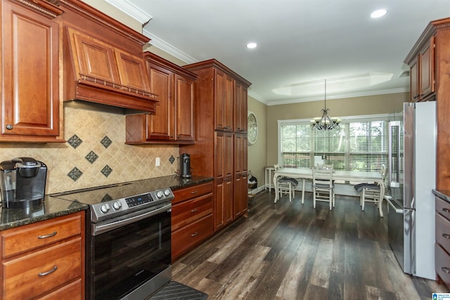 295 Homestead Dr, Cropwell, AL 35054 - kitchen with appliances with stainless steel finishes, ornamental molding, dark wood-style floors, a chandelier, and tasteful backsplash