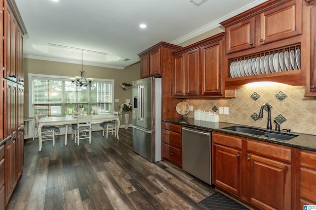 295 Homestead Dr, Cropwell, AL 35054 - kitchen featuring appliances with stainless steel finishes, dark wood-style flooring, tasteful backsplash, a chandelier, and dark stone countertops