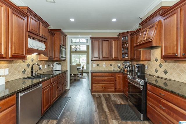 295 Homestead Dr, Cropwell, AL 35054 - kitchen with appliances with stainless steel finishes, ornamental molding, dark wood-style floors, dark stone counters, and premium range hood