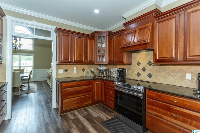295 Homestead Dr, Cropwell, AL 35054 - kitchen with stainless steel electric stove, crown molding, dark wood-type flooring, glass insert cabinets, and decorative backsplash