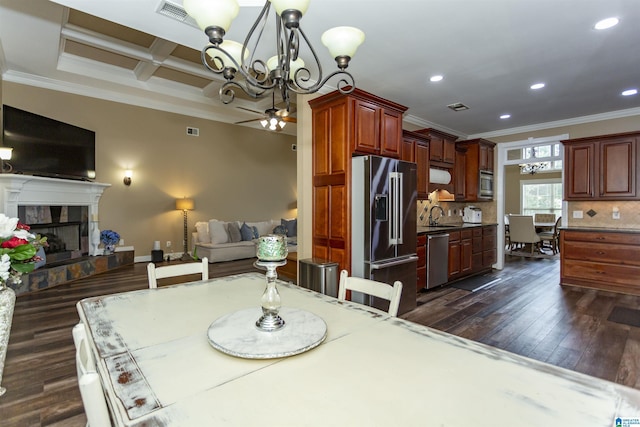 295 Homestead Dr, Cropwell, AL 35054 - dining space featuring a chandelier, ornamental molding, dark wood finished floors, recessed lighting, and a fireplace