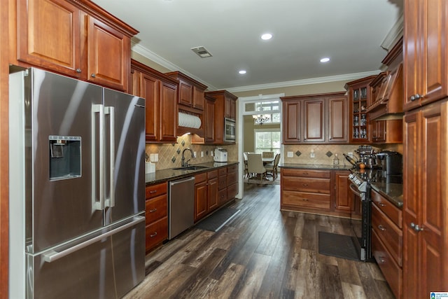 295 Homestead Dr, Cropwell, AL 35054 - kitchen featuring appliances with stainless steel finishes, ornamental molding, dark wood finished floors, glass insert cabinets, and tasteful backsplash
