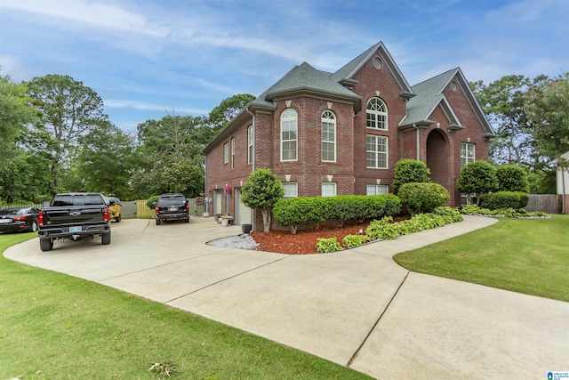 295 Homestead Dr, Cropwell, AL 35054 - view of front of home with brick siding, concrete driveway, a front yard, and a garage