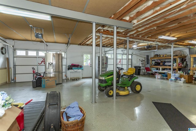 295 Homestead Dr, Cropwell, AL 35054 - garage with stainless steel refrigerator with ice dispenser, a garage door opener, and electric panel