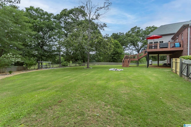 295 Homestead Dr, Cropwell, AL 35054 - fenced backyard featuring stairway, a wooden deck, and view of wooded area
