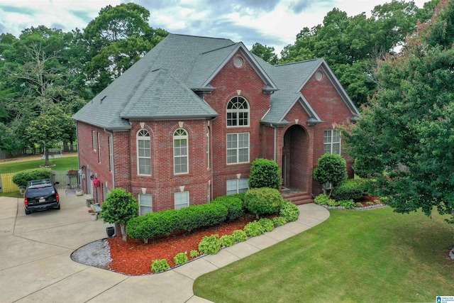 295 Homestead Dr, Cropwell, AL 35054 - view of front of property featuring brick siding, driveway, a front yard, an attached garage, and roof with shingles