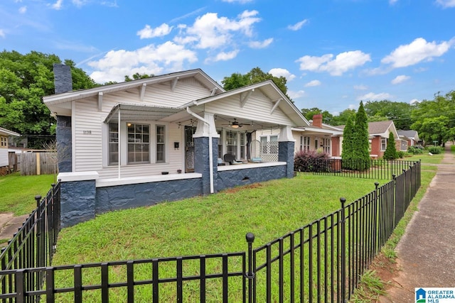 1138 14th Ave S, Birmingham, AL 35205 - view of front facade featuring a ceiling fan, covered porch, and a chimney