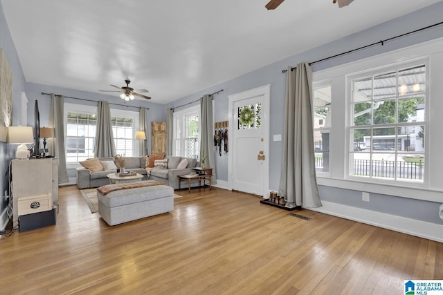 1138 14th Ave S, Birmingham, AL 35205 - living room with a ceiling fan, light wood-type flooring, and baseboards