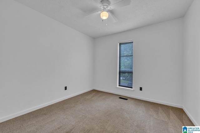 1117 Oak Creek Trl NE, Pinson, AL 35215 - carpeted empty room featuring a textured ceiling and ceiling fan