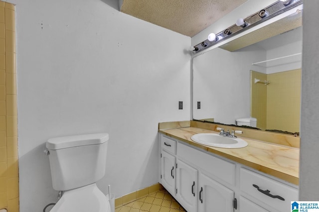 1117 Oak Creek Trl NE, Pinson, AL 35215 - bathroom featuring vanity, a textured ceiling, and a shower