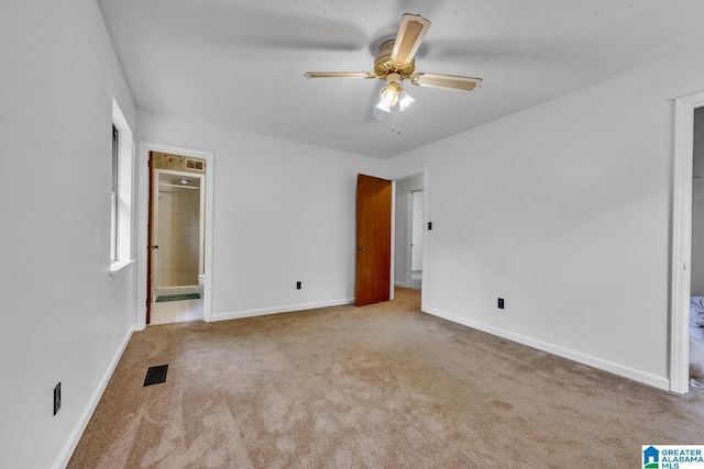 1117 Oak Creek Trl NE, Pinson, AL 35215 - unfurnished bedroom with carpet flooring, connected bathroom, and ceiling fan