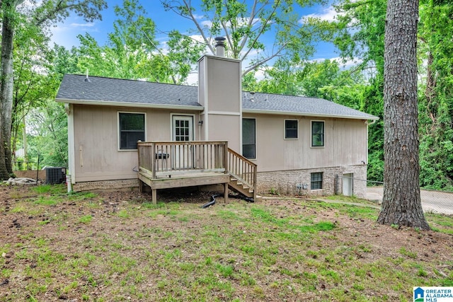 1117 Oak Creek Trl NE, Pinson, AL 35215 - back of house featuring a deck, a chimney, stairway, a garage, and roof with shingles