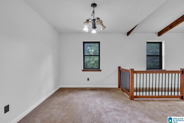 1117 Oak Creek Trl NE, Pinson, AL 35215 - carpeted spare room featuring a chandelier and beamed ceiling