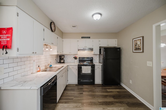 1529 Applegate Ln, Alabaster, AL 35007 - kitchen featuring black appliances, a sink, under cabinet range hood, dark wood-style floors, and tasteful backsplash
