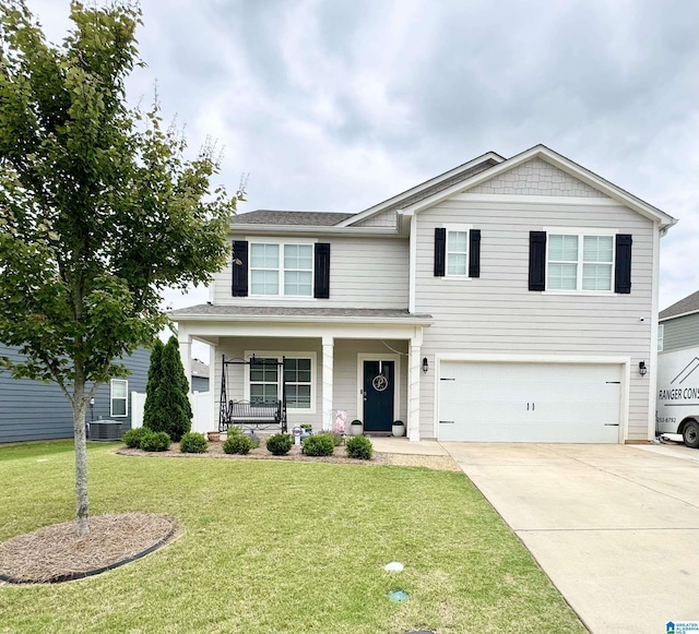 1009 Canvasback Way, Alabaster, AL 35007 - view of front of property with a garage, a porch, driveway, a front lawn, and roof with shingles
