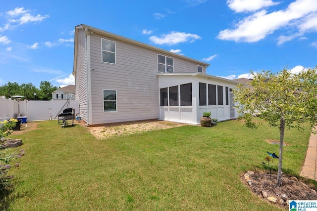 1009 Canvasback Way, Alabaster, AL 35007 - rear view of house featuring a sunroom and a fenced backyard