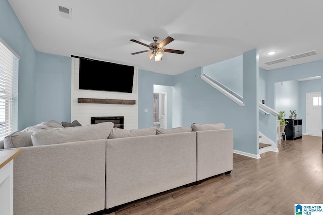 1009 Canvasback Way, Alabaster, AL 35007 - living area with a ceiling fan, stairway, wood finished floors, a fireplace, and recessed lighting