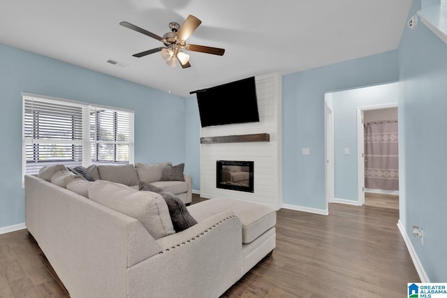 1009 Canvasback Way, Alabaster, AL 35007 - living area featuring ceiling fan, dark wood-style flooring, and a large fireplace