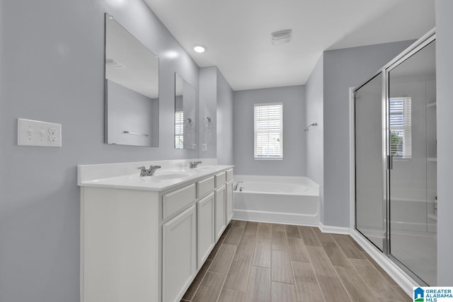 1009 Canvasback Way, Alabaster, AL 35007 - full bathroom with a garden tub, a stall shower, double vanity, and wood tiled floors