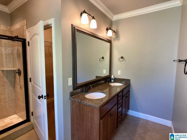 168 Willow View Ln, Westover, AL 35186 - full bathroom with crown molding, a shower stall, double vanity, a walk in closet, and tile patterned flooring