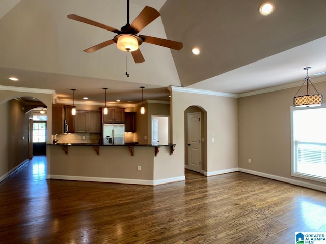 168 Willow View Ln, Westover, AL 35186 - unfurnished living room featuring arched walkways, crown molding, dark wood-style flooring, recessed lighting, and ceiling fan