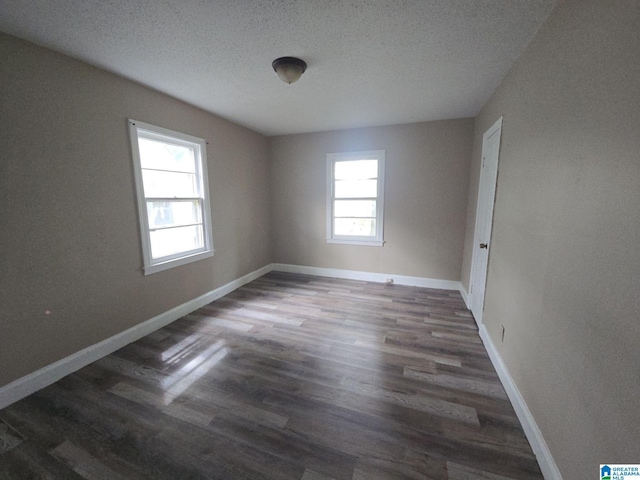 1414 27th St, Birmingham, AL 35218 - empty room featuring wood finished floors and a textured ceiling