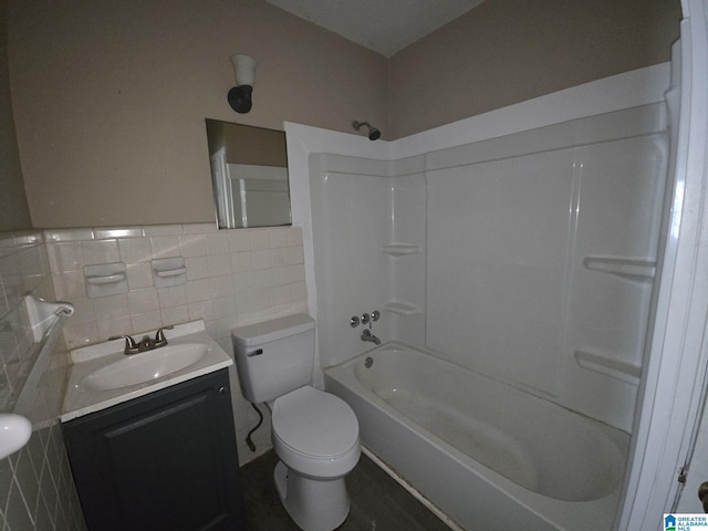 1414 27th St, Birmingham, AL 35218 - full bathroom featuring vanity, bathing tub / shower combination, tile walls, and wainscoting