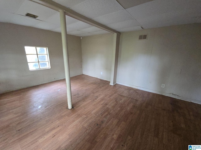 1414 27th St, Birmingham, AL 35218 - empty room with wood finished floors and a drop ceiling