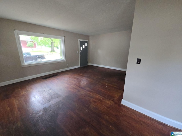 1414 27th St, Birmingham, AL 35218 - spare room featuring wood finished floors and baseboards