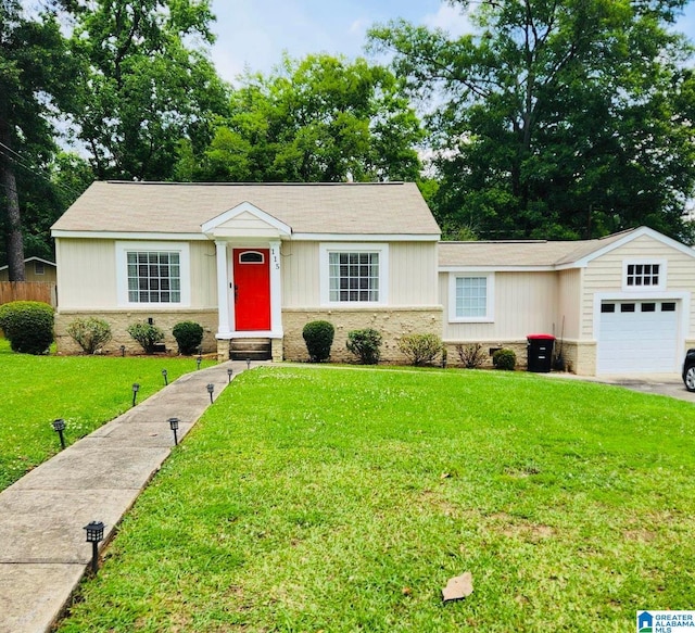 115 Ridgeway Ave, Gadsden, AL 35901 - view of front facade with a front yard, an attached garage, and brick siding
