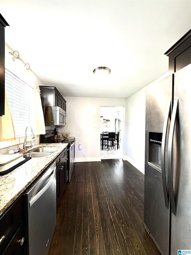 115 Ridgeway Ave, Gadsden, AL 35901 - kitchen with stainless steel appliances, dark wood finished floors, and light stone counters