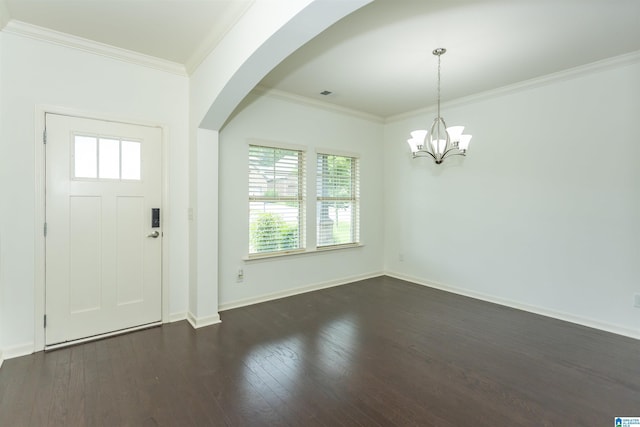 319 Glen Cross Way, Trussville, AL 35173 - foyer entrance featuring a chandelier, crown molding, dark wood finished floors, and arched walkways