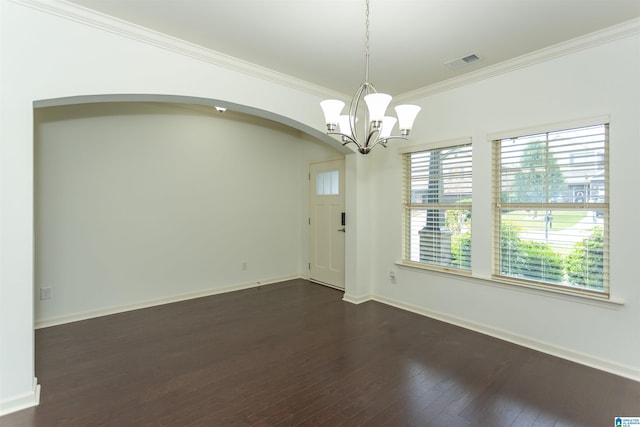 319 Glen Cross Way, Trussville, AL 35173 - empty room featuring dark wood-style flooring, crown molding, a chandelier, and arched walkways