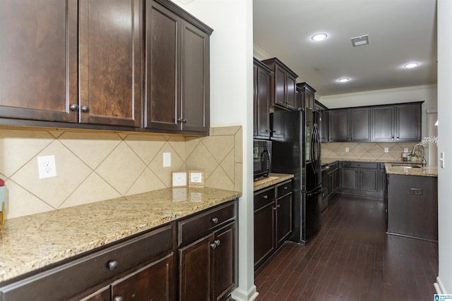 319 Glen Cross Way, Trussville, AL 35173 - kitchen featuring tasteful backsplash, black appliances, light stone countertops, dark brown cabinetry, and ornamental molding