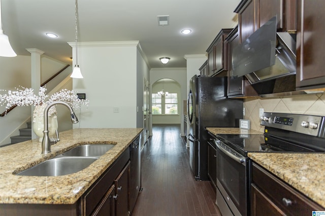 319 Glen Cross Way, Trussville, AL 35173 - kitchen with appliances with stainless steel finishes, crown molding, dark brown cabinets, backsplash, and arched walkways