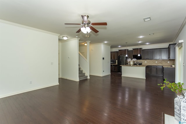 319 Glen Cross Way, Trussville, AL 35173 - unfurnished living room featuring ornamental molding, a ceiling fan, dark wood-type flooring, stairs, and recessed lighting