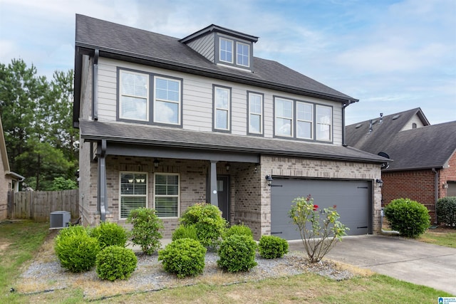 319 Glen Cross Way, Trussville, AL 35173 - view of front of property with an attached garage, driveway, covered porch, brick siding, and roof with shingles