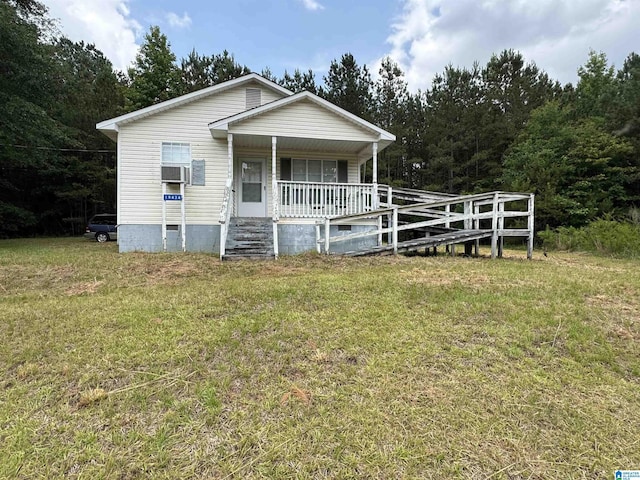 19434 Dan Shelby Rd, Northport, AL 35475 - view of front facade featuring a porch, a front lawn, crawl space, and cooling unit