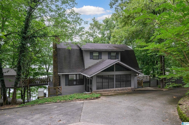 840 Black Acres Rd, Cropwell, AL 35054 - colonial inspired home with a sunroom, a chimney, concrete driveway, a shingled roof, and a gate