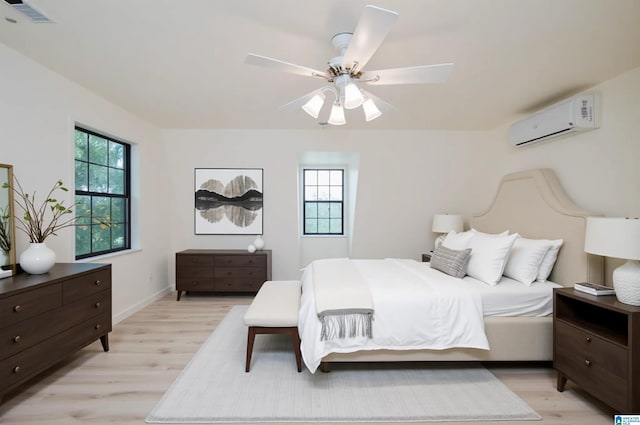 840 Black Acres Rd, Cropwell, AL 35054 - bedroom with a wall mounted air conditioner, multiple windows, light wood-style flooring, and ceiling fan