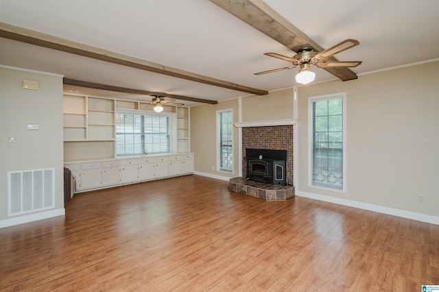 840 Black Acres Rd, Cropwell, AL 35054 - unfurnished living room with a ceiling fan, beam ceiling, light wood finished floors, and a fireplace