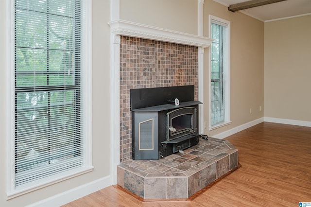 840 Black Acres Rd, Cropwell, AL 35054 - detailed view of wood finished floors, crown molding, and a wood stove