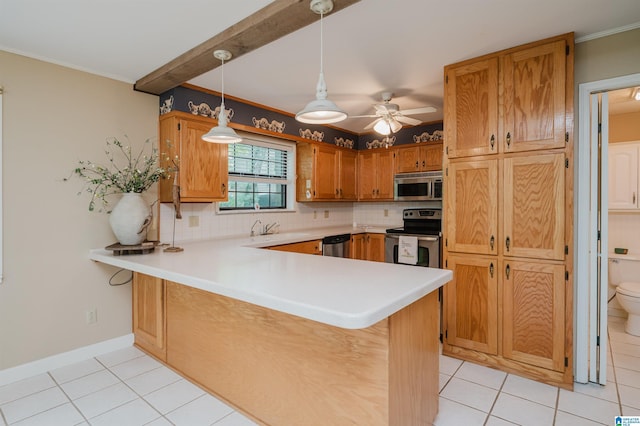 840 Black Acres Rd, Cropwell, AL 35054 - kitchen with stainless steel appliances, light tile patterned floors, a peninsula, tasteful backsplash, and ornamental molding