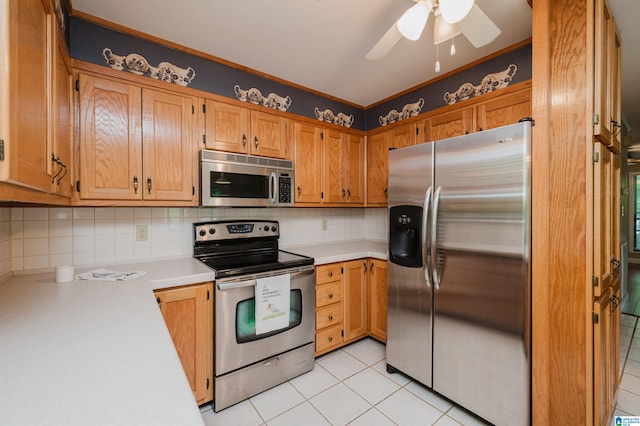 840 Black Acres Rd, Cropwell, AL 35054 - kitchen with appliances with stainless steel finishes, light countertops, light tile patterned floors, and decorative backsplash