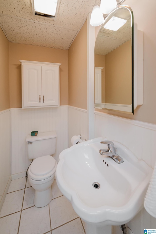 840 Black Acres Rd, Cropwell, AL 35054 - bathroom with wainscoting and tile patterned flooring