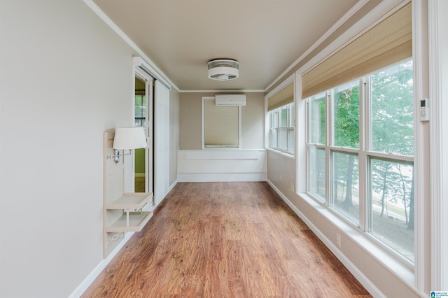 840 Black Acres Rd, Cropwell, AL 35054 - unfurnished sunroom featuring a wall mounted AC, wood finished floors, and crown molding